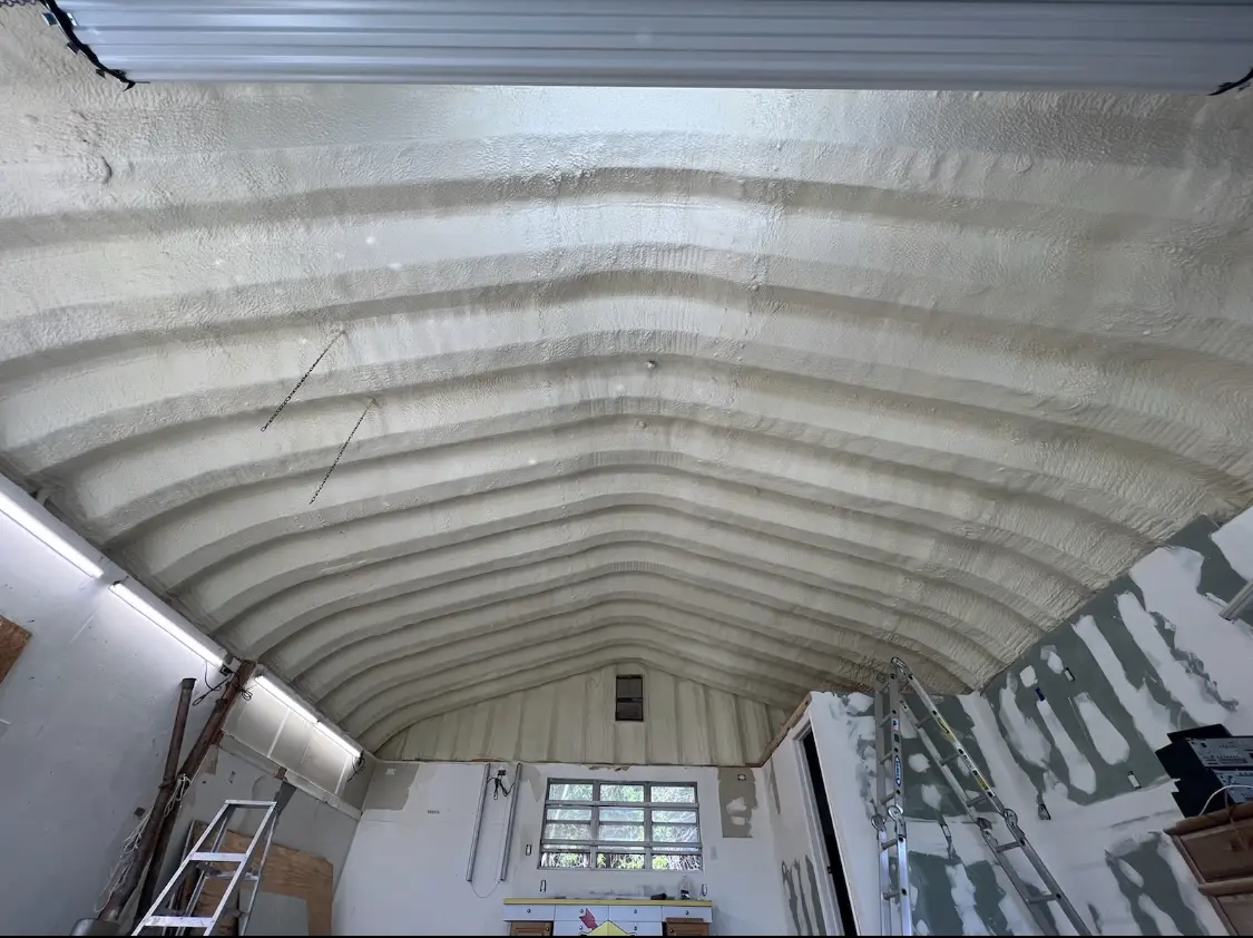 Spray polyurethane foam applied to the underside of a metal roof deck in Lamesa